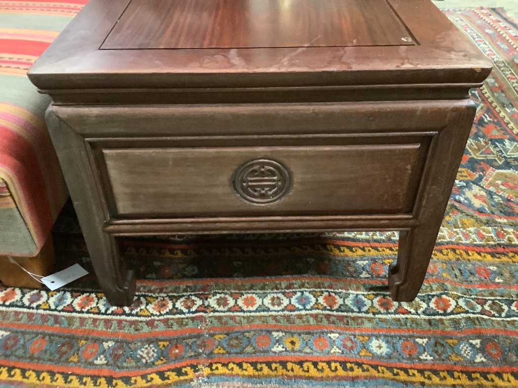 A Chinese hardwood rectangular three drawer coffee table, width 136cm, depth 51cm, height 40cm